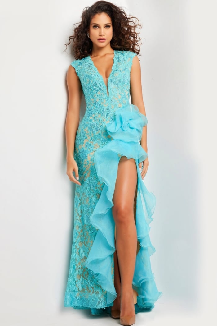 Model in front view of Jovani 38668 turquoise dress with deep neckline.