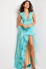 Model in Jovani 38668 turquoise gown with high slit and lace details.