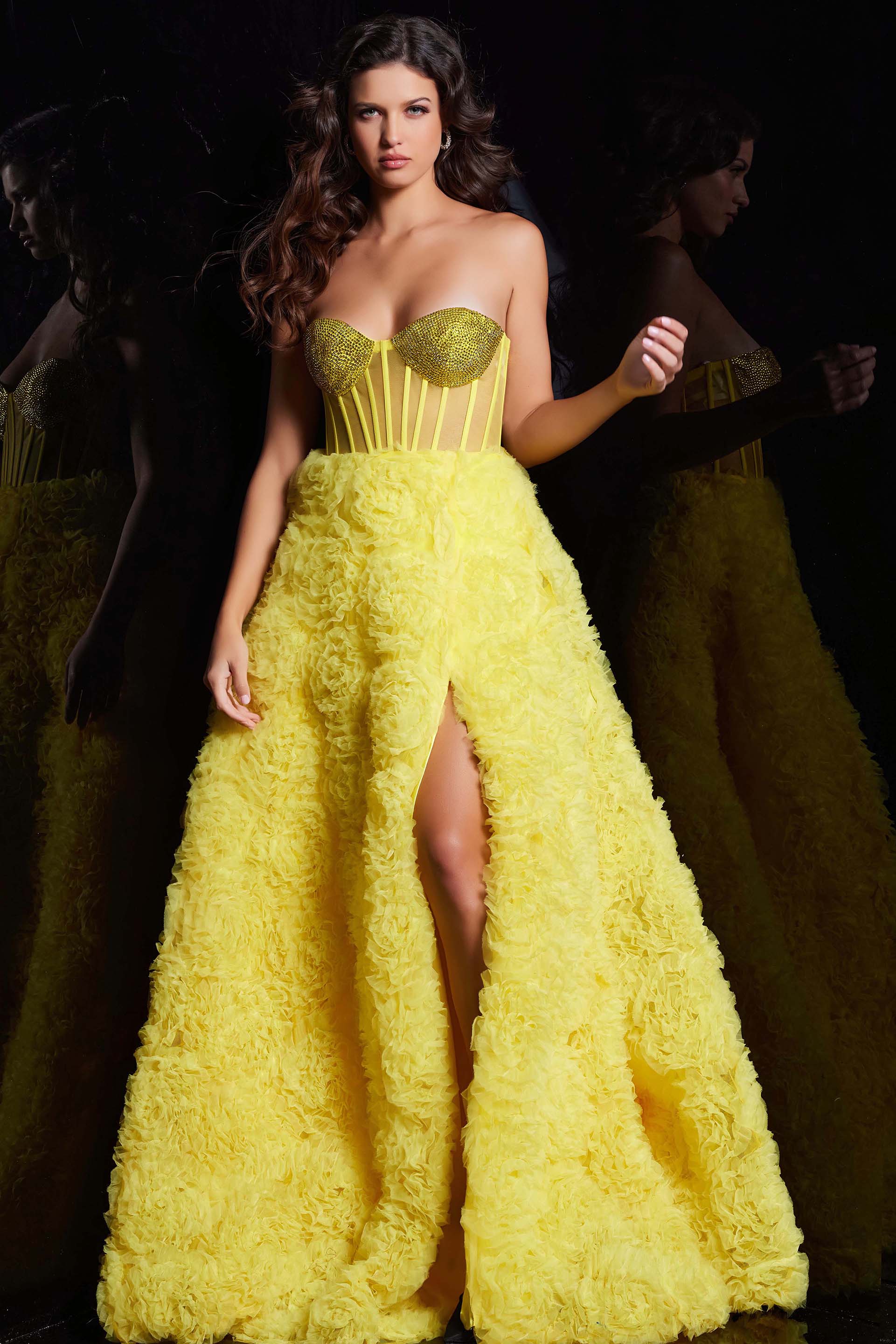 38674_yellow.jpg Model wearing Jovani 38674 yellow gown with floral appliqué and high slit.