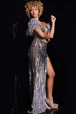 Model wearing Jovani 38679 elegant gown, side view showcasing high slit and feather detailed sleeves.