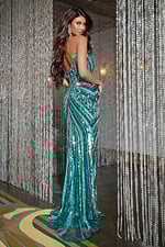 Back view of model wearing Jovani 38707, green sequined gown.