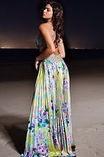 Back view of Jovani 38733 with open-back design and flowing multi-colored skirt.