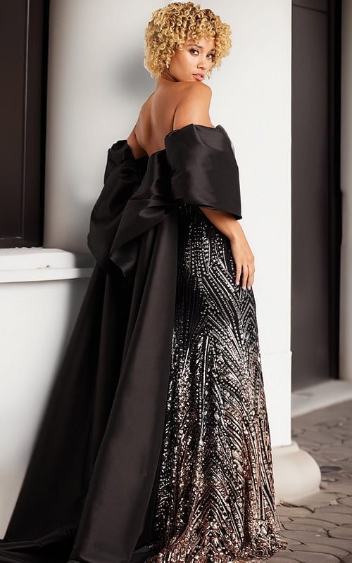 model showing back view of 38746 black gown with bow detail