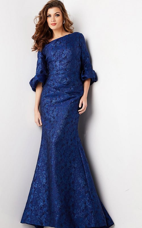Model wearing Jovani 38791 navy mermaid gown with ruffled sleeves, front view.