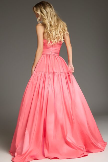 Model wearing 38831 in a pink strapless dress showing back view