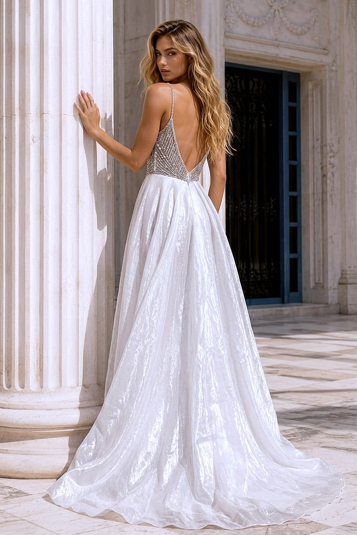 Jovani 38860 open-back silver beaded gown with spaghetti straps and white flowing overskirt