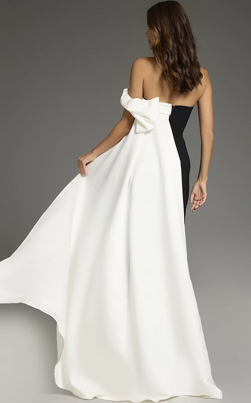 Back view of Jovani 38864 elegant black and white gown with draped shoulder