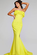 Model wearing Jovani 38922 in yellow, front view with ruffled neckline.