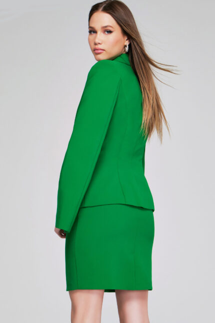 Back view of model wearing Jovani 38926 green dress showing fitted back.