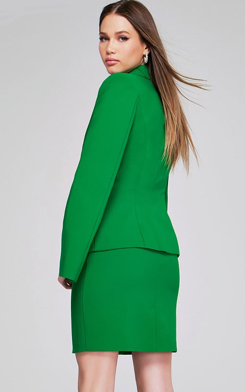 Back view of model wearing Jovani 38926 green dress showing fitted back.