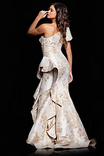 model wearing 38935 back view gold evening gown with ruffle details
