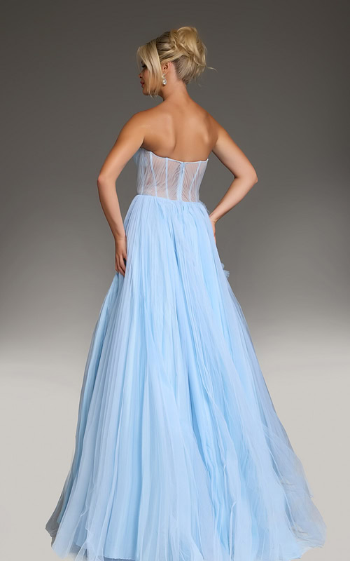 Model wearing Jovani 38946 black gown, back view showing elegant draping.