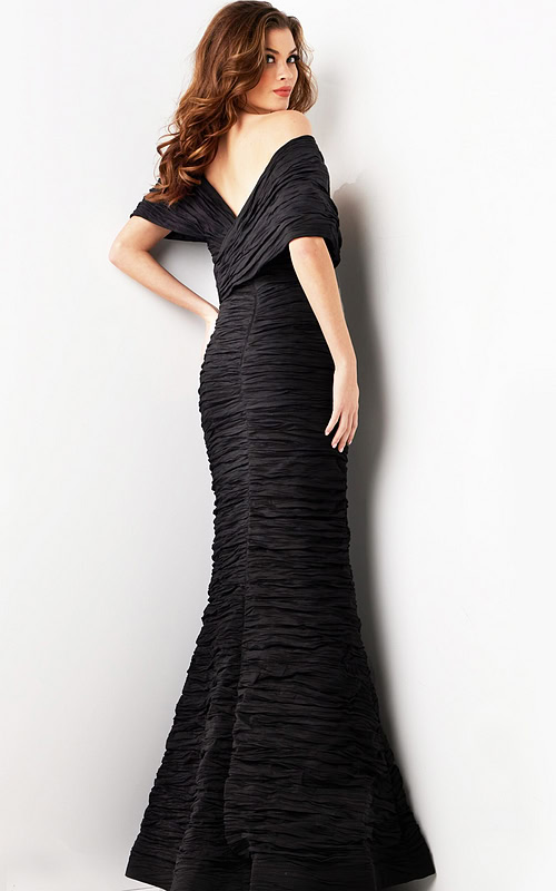 Model displaying the back of Jovani 38954 black gown with mermaid style.