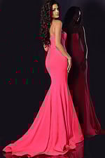 Back view of model wearing Jovani 38974 pink mermaid gown with flared silhouette
