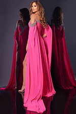 Back view of Jovani 38996 pink gown showing cape sleeves and floor-length skirt