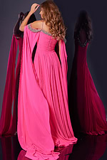 Back view of Jovani 38996 hot pink dress with cape sleeves and draped skirt