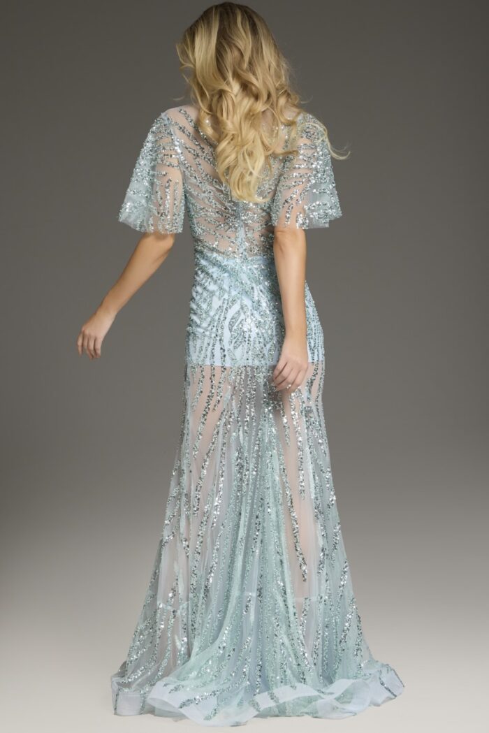 Back view of model wearing Jovani 39008 blue gown with glittering accents.