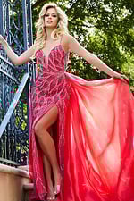 Model presenting Jovani 39042 red gown, highlighting beadwork and flowing design.