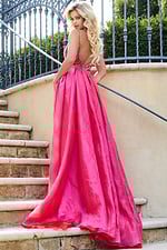 Back view of Jovani 39042 red gown with elegant train and low back.