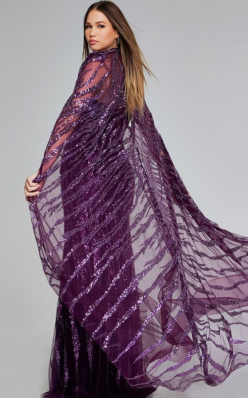 Back view of model in Jovani 39046 purple gown with sequin detailing and cape.
