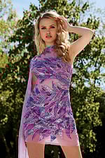 Model in Jovani 39062 lilac dress with elegant sequins and a high neckline.