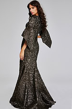 Rear view of model in Jovani 39080 brown gown with flowing hem