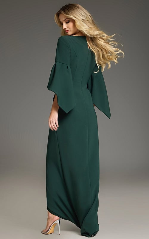 Model wearing Jovani 39082 green dress, showing back view with bell sleeves