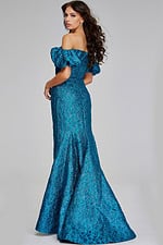 Back view of model wearing Jovani 39113, showcasing the dress's elegant teal fabric and fitted silhouette.