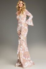 Model wearing Jovani 39118 nude gown side view with floral details.