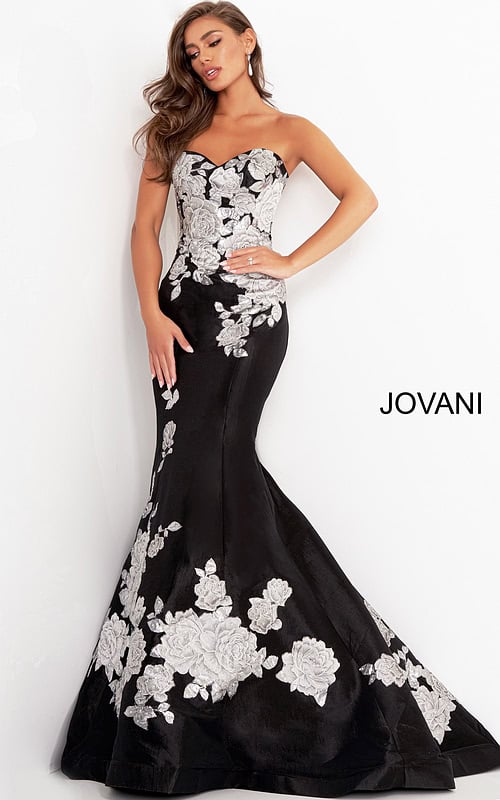 Model wearing Jovani 3917 black gown with silver floral embroidery from the front view.