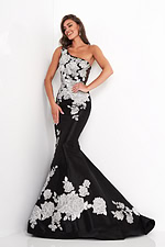 Model wearing Jovani 3918 black dress with silver floral lace, full length front view.