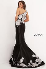 Model wearing Jovani 3918 black dress with silver floral lace, detailed back view.