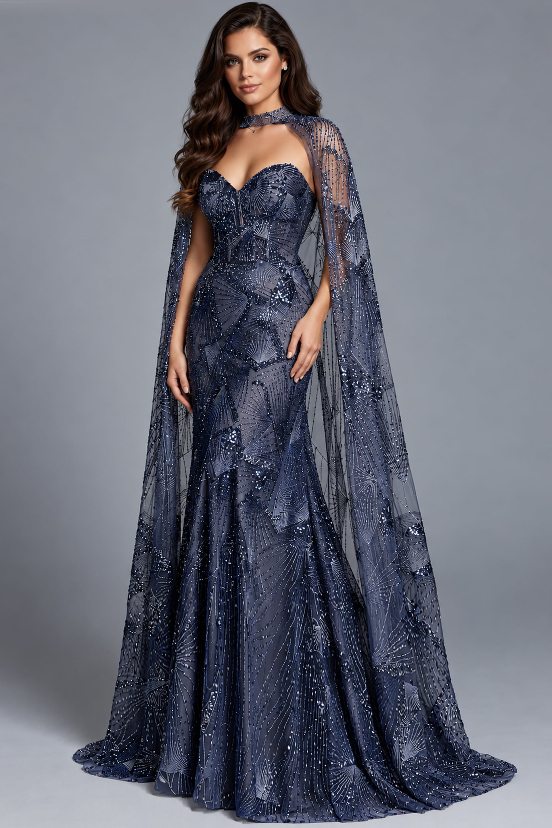 Navy beaded cape gown shown full length with sheer overlay and sweep train