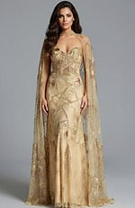 Model wearing gold strapless embellished gown with sheer beaded cape and intricate sequin pattern.