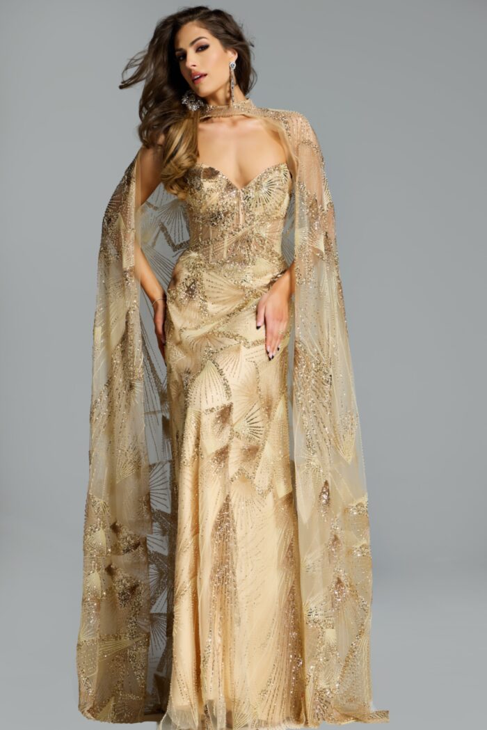 Model wearing gold strapless embellished gown with sheer beaded cape and intricate sequin pattern.