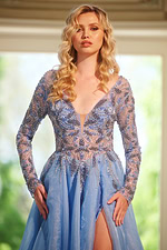 Close-up of model in Jovani 39251 blue gown showcasing beaded details.