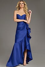 Model showcasing Jovani 39265 blue gown from front with ruffled design
