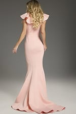 Model wearing Jovani 39299 blush gown displaying elegant back design with smooth lines.