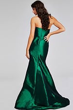 Model in Jovani 39368 green gown, highlighting the elegant flared train from the back.