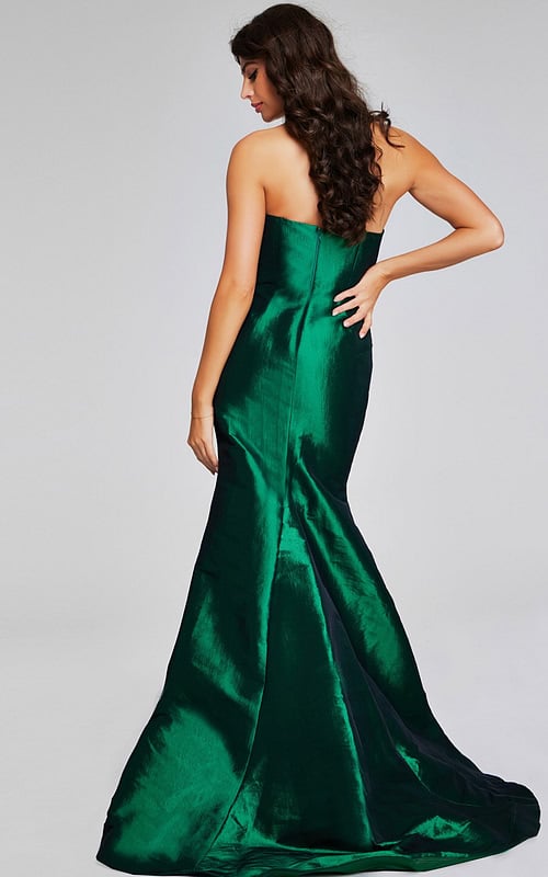 Model in Jovani 39368 green gown, highlighting the elegant flared train from the back.