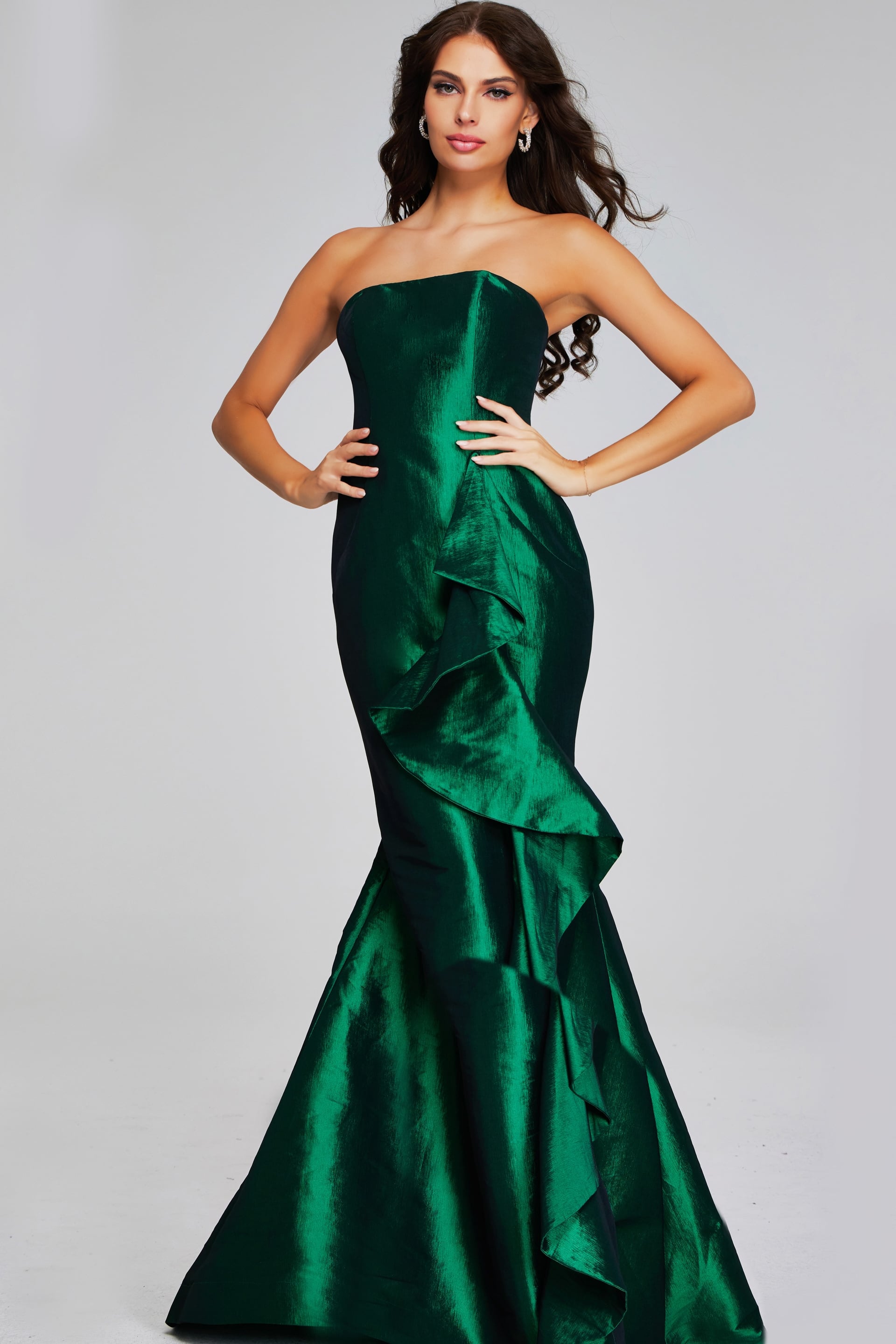 39368-GREEN-209.jpg Model wearing Jovani 39368 green gown with ruffle detail, front view.