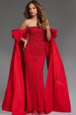 Model wearing Jovani 39377 front view with red gown, strapless, embellished bodice, and detachable cape.