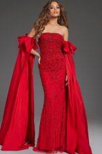 Model wearing Jovani 39377 front view featuring elegant strapless red gown with intricate beadwork.