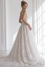 Sleeveless deep V embroidered tulle wedding gown with full A-line skirt and floral appliqué detailing