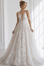 plunging floral lace mermaid wedding gown with sheer corset bodice and fitted silhouette