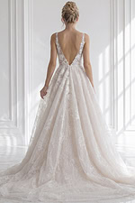 Backless spaghetti strap floral lace bridal gown with fitted silhouette and button detail back closure
