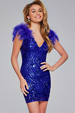 Model wearing Jovani 39448 royal blue sequined dress with feathered cap sleeves, front view.