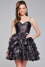 Jovani 39654 black cocktail dress with sweetheart neckline and ruffled skirt worn by model.