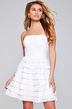 Model wearing Jovani 39658 short white dress, showcasing an elegant strapless design.