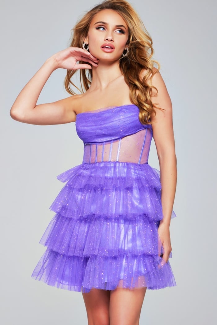 Model wearing Jovani 39666 purple dress, front view looking aside.